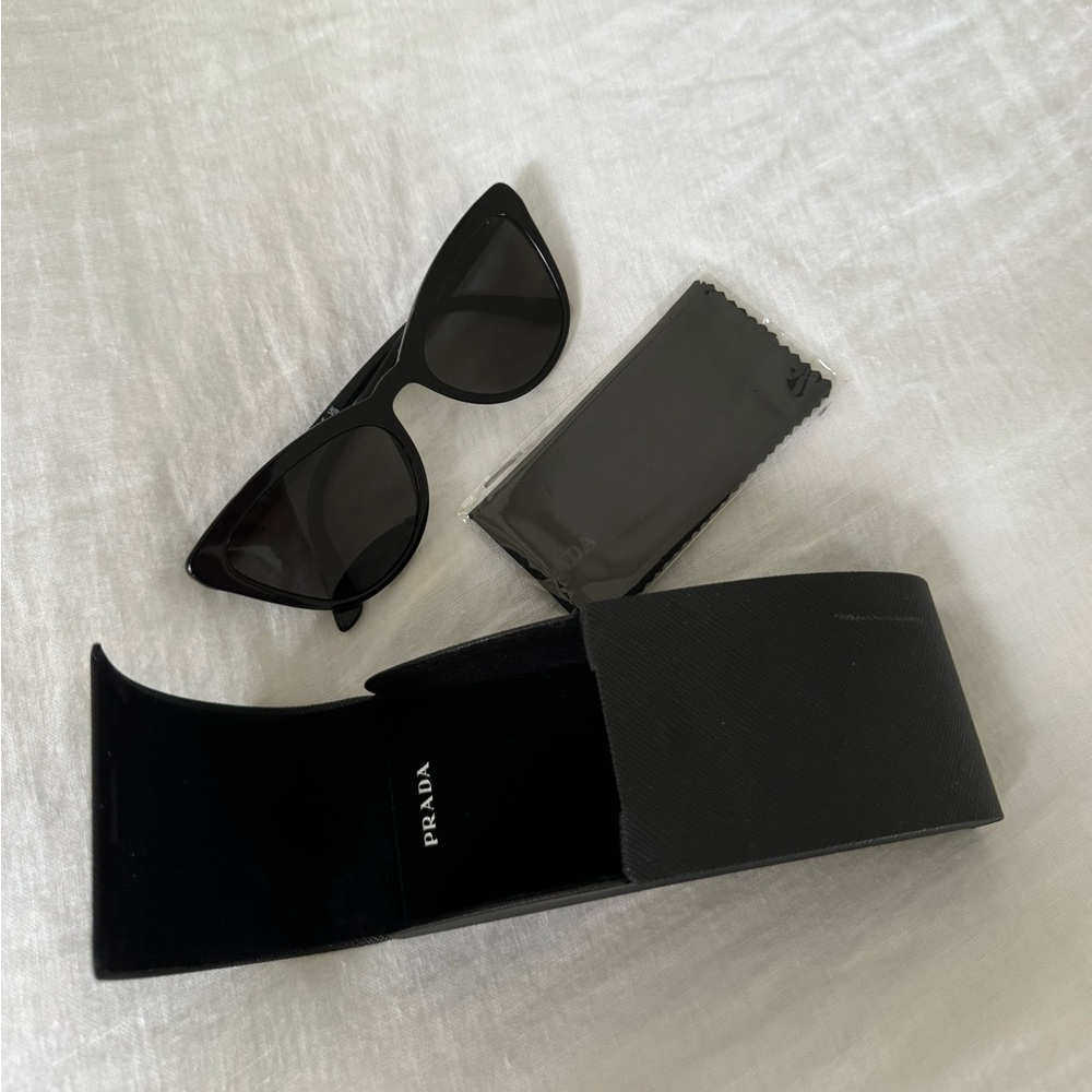 Prada cat walk sunglasses with case.